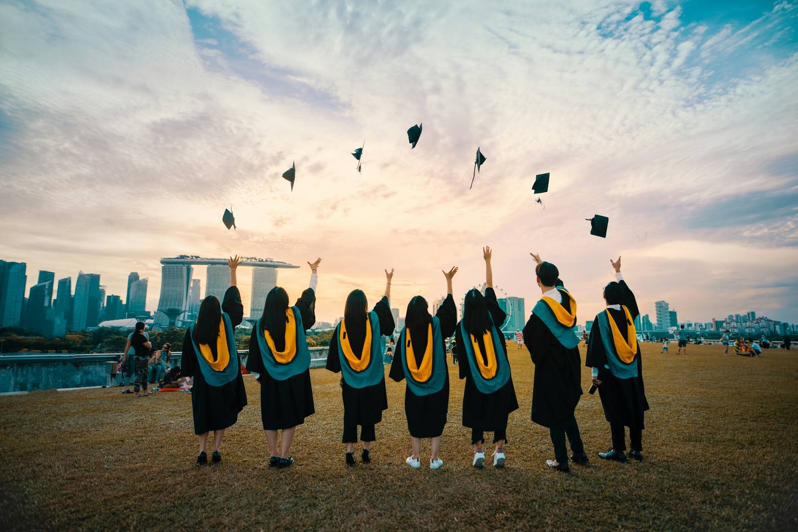 Graduates throwing their caps in the air
