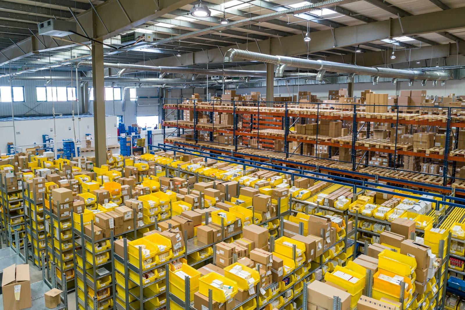 A busy distribution warehouse with stacked shelves