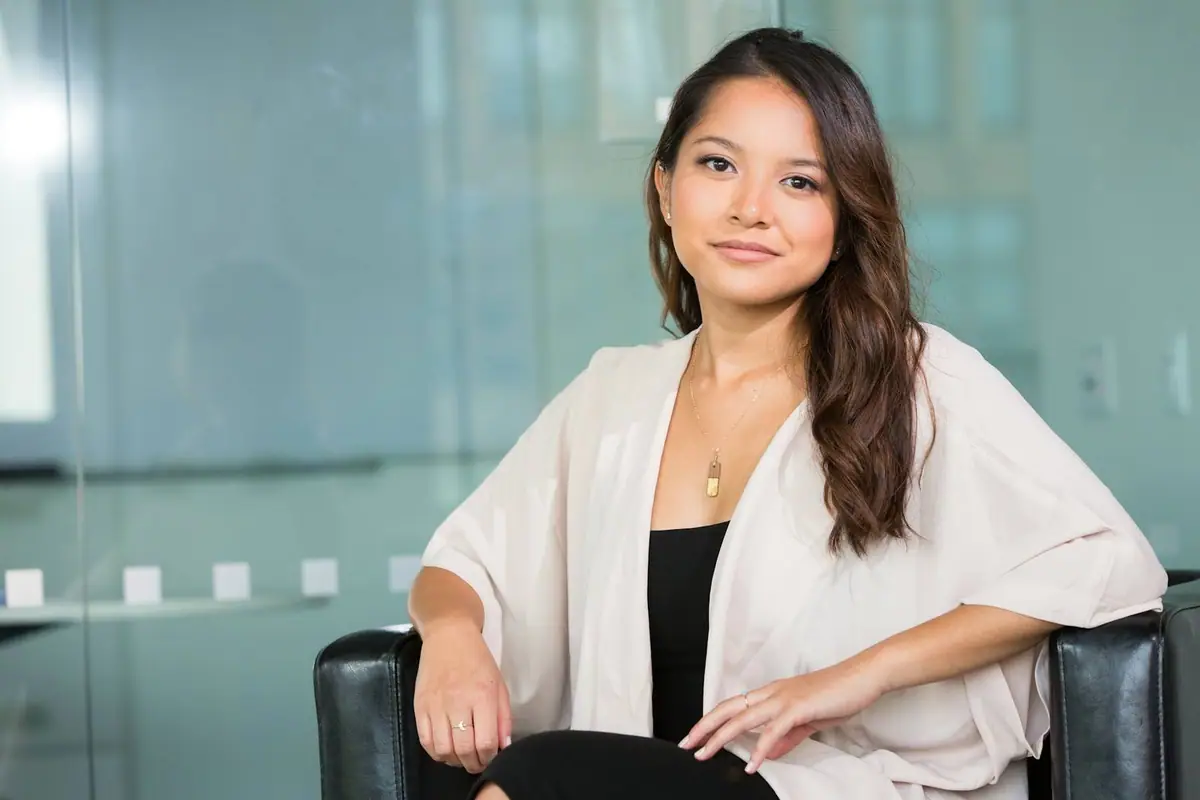 A confident professional seated in a bright office