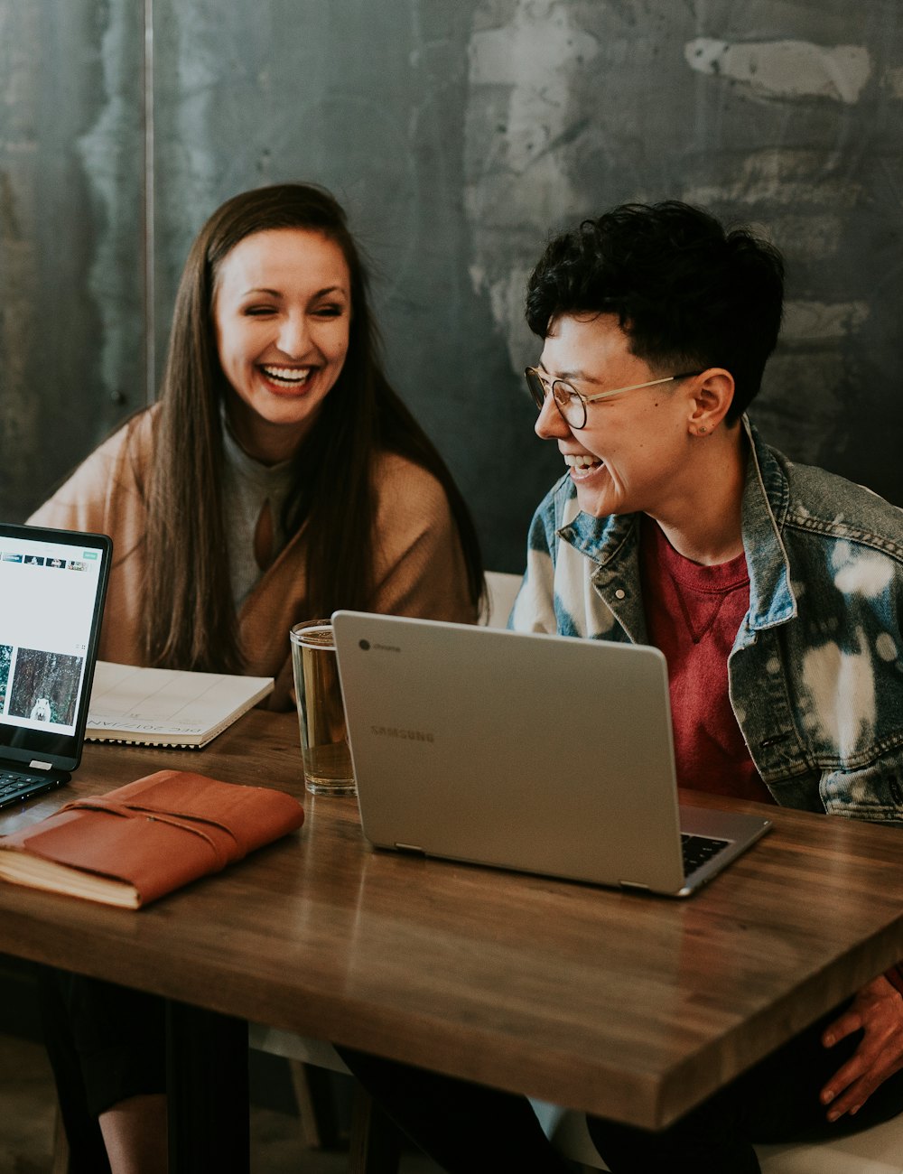 Adult learners studying together with laptops
